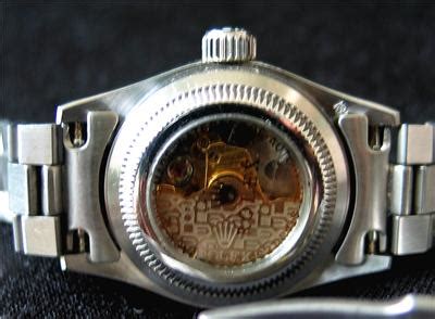 rolex watch with glass back.